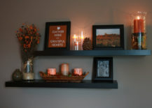 Floating shelves with candles, flowers, and a picture that reads "Gather Here, Grateful Hearts"