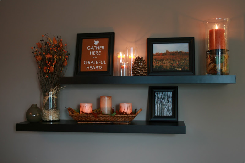 Floating shelves with candles, flowers, and a picture that reads "Gather Here, Grateful Hearts"