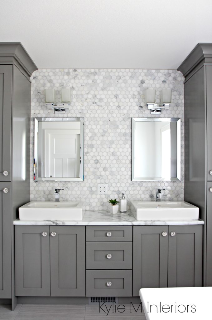 Gray bathroom with marble sink and natural fixrures.