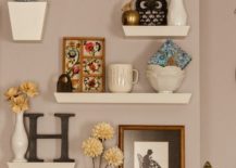 Four white floating shelves that come in two sizes showcasing vases, bowls, and a mason jar.