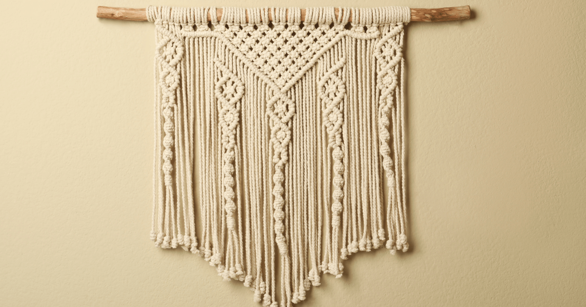 A DIY home decor consisting of wood hung onto the wall with fabric attached to it.