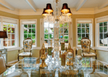 Victorian style dining room with glass table and victorian styled furniture.