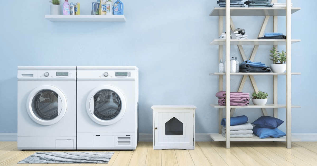 A laundry room with a small white cat litter box.