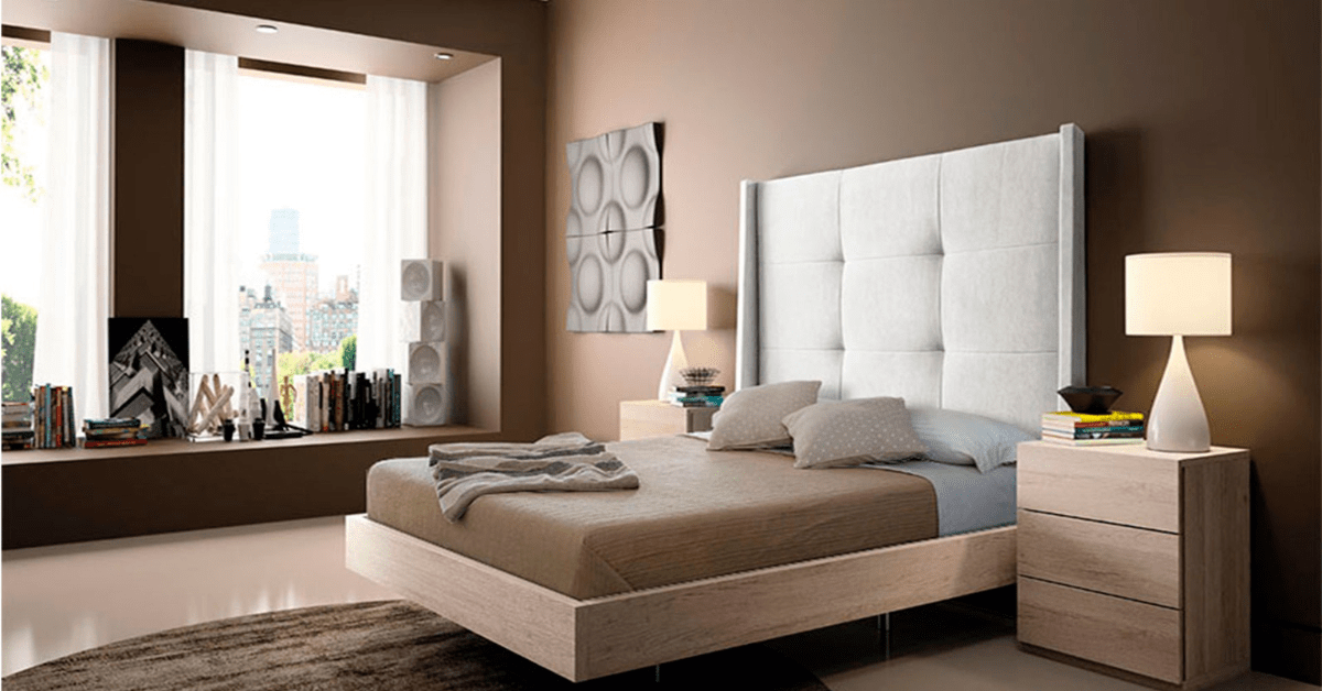 Wooden bed frame in a modern bedroom.